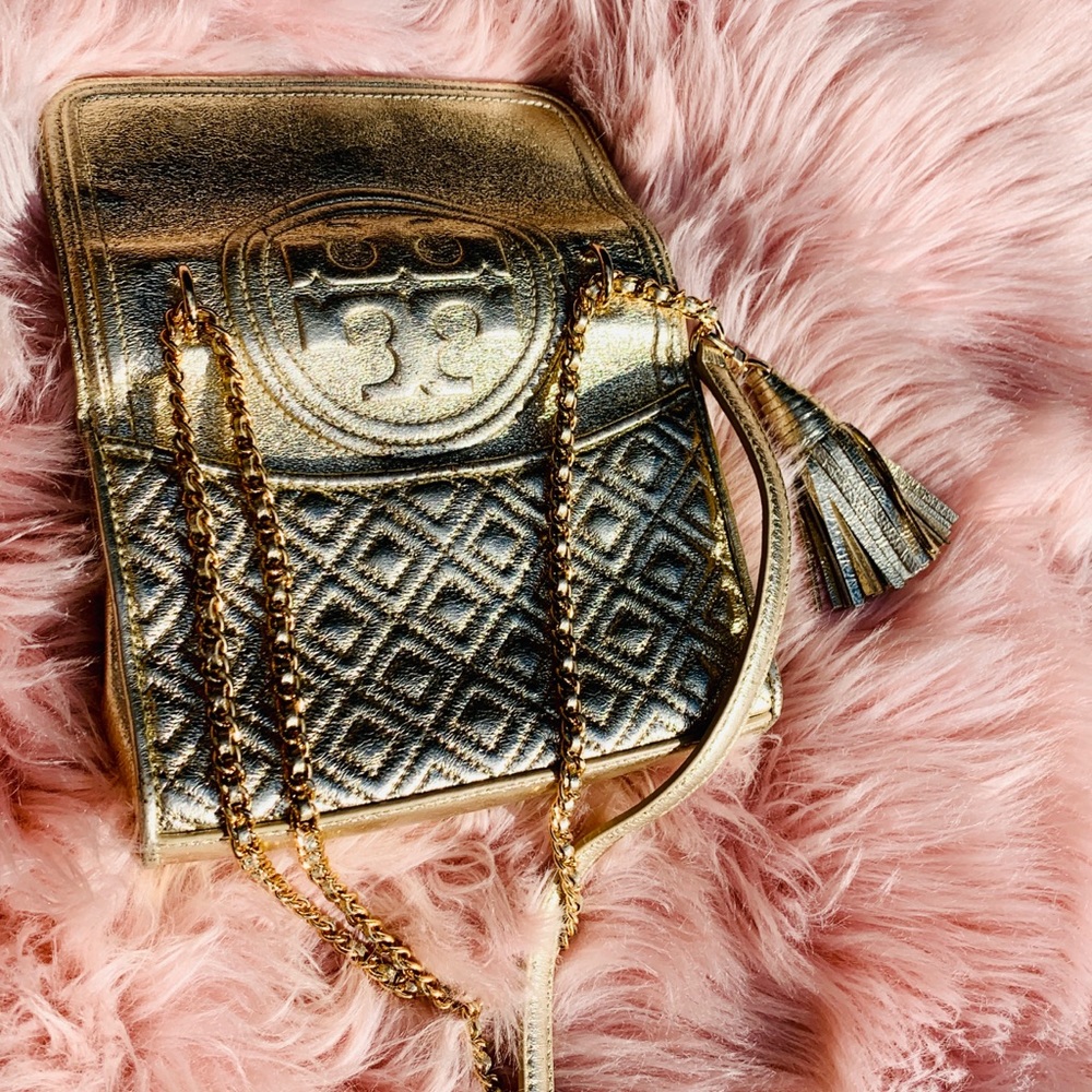Gold Tory Burch crossbody bag with chains